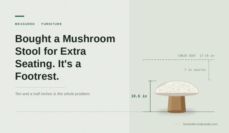 A stylish pink bouclé mushroom stool is situated in a modern minimalist living room