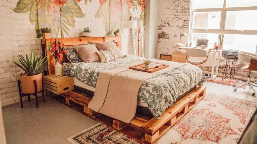 Pallet bed frame with slat-gap storage and wood headboard.