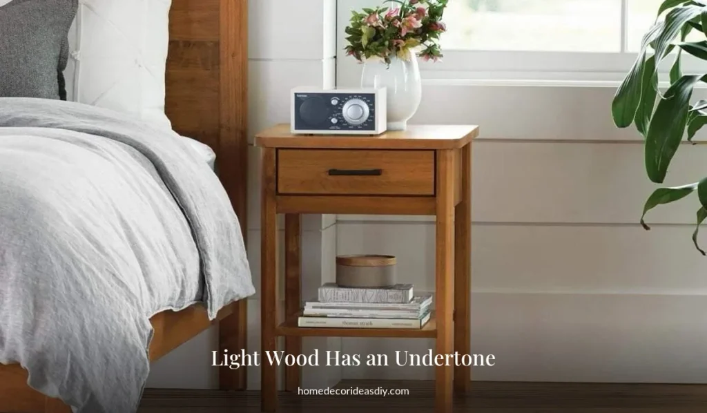 Light wood nightstand on hardwood floors showing a warmer undertone