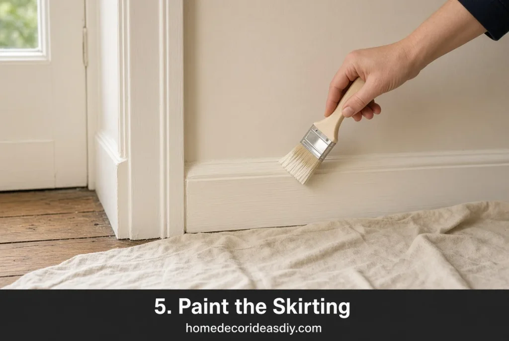 Satinwood on living room skirting painted the same colour as the walls