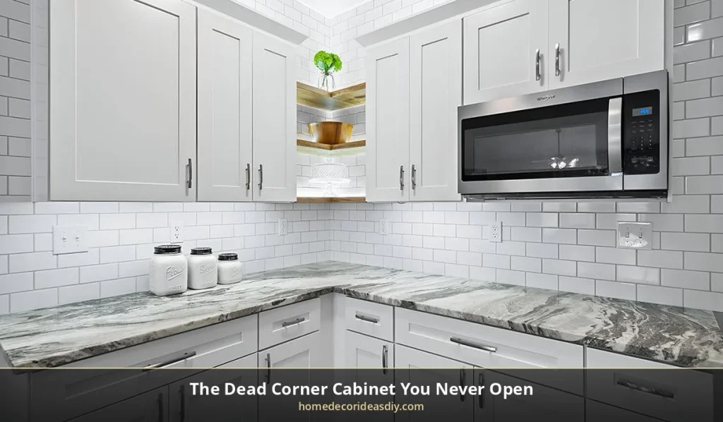 Corner kitchen with a microwave cabinet on the side wall and unused open shelves in the dead corner
