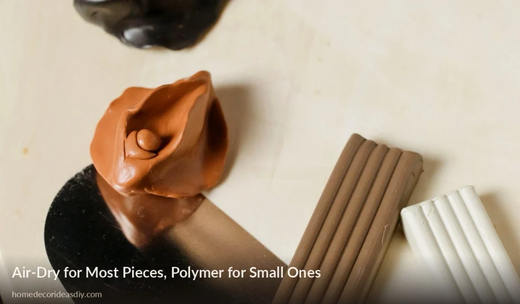 Blocks of polymer clay and a small terracotta pinch shape on a work table