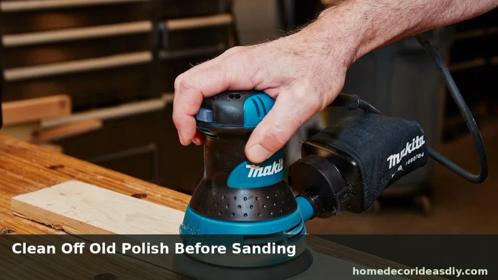 DIY Coffee Table Makeover prep sanding a tabletop with orbital sander after degreasing old polish