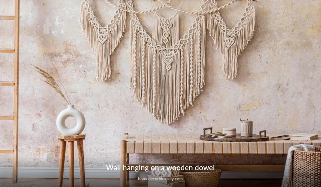 Macrame wall hanging on a wooden dowel with square knots and straight V fringe