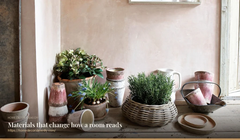 Terracotta, glazed ceramic and wicker decorative planters grouped on a wooden shelf against a plaster wall