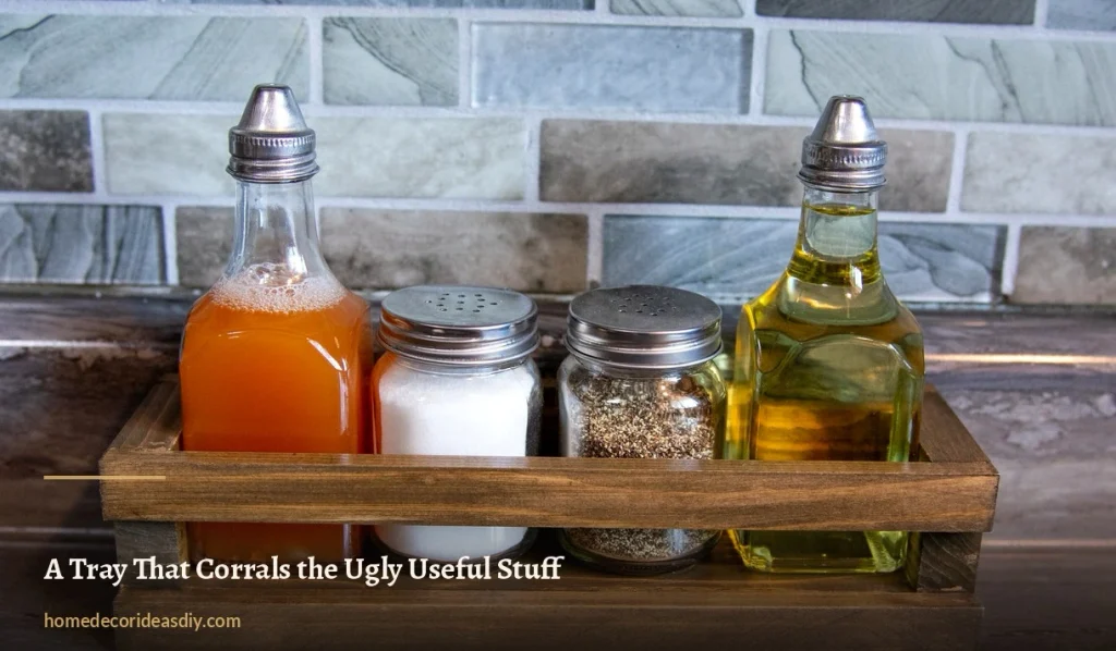 Wooden tray holding oil, vinegar, salt and pepper shakers on a kitchen counter