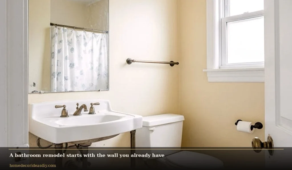 Dated small bathroom before a bathroom remodel, old basin and yellow walls