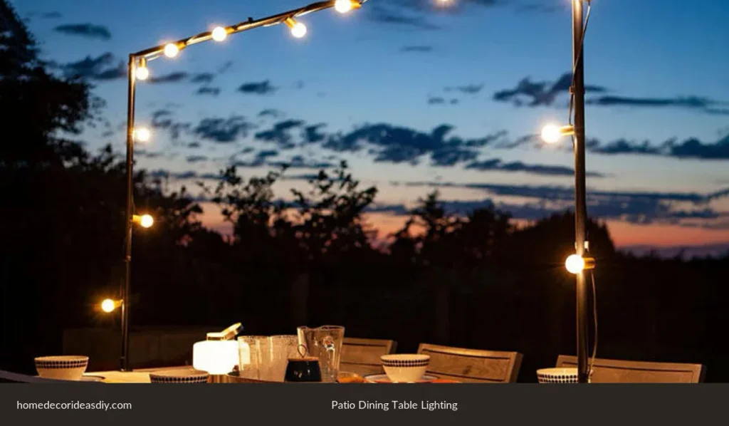Outdoor table lamps on a dining table for four, with extra string light only as backup.